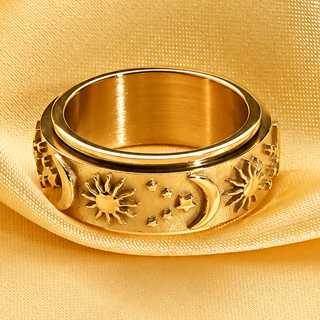 Bague anti-stress anneau tournant Circadien dorée, anneau tournant sablé orné de soleils, lunes et étoiles en relief