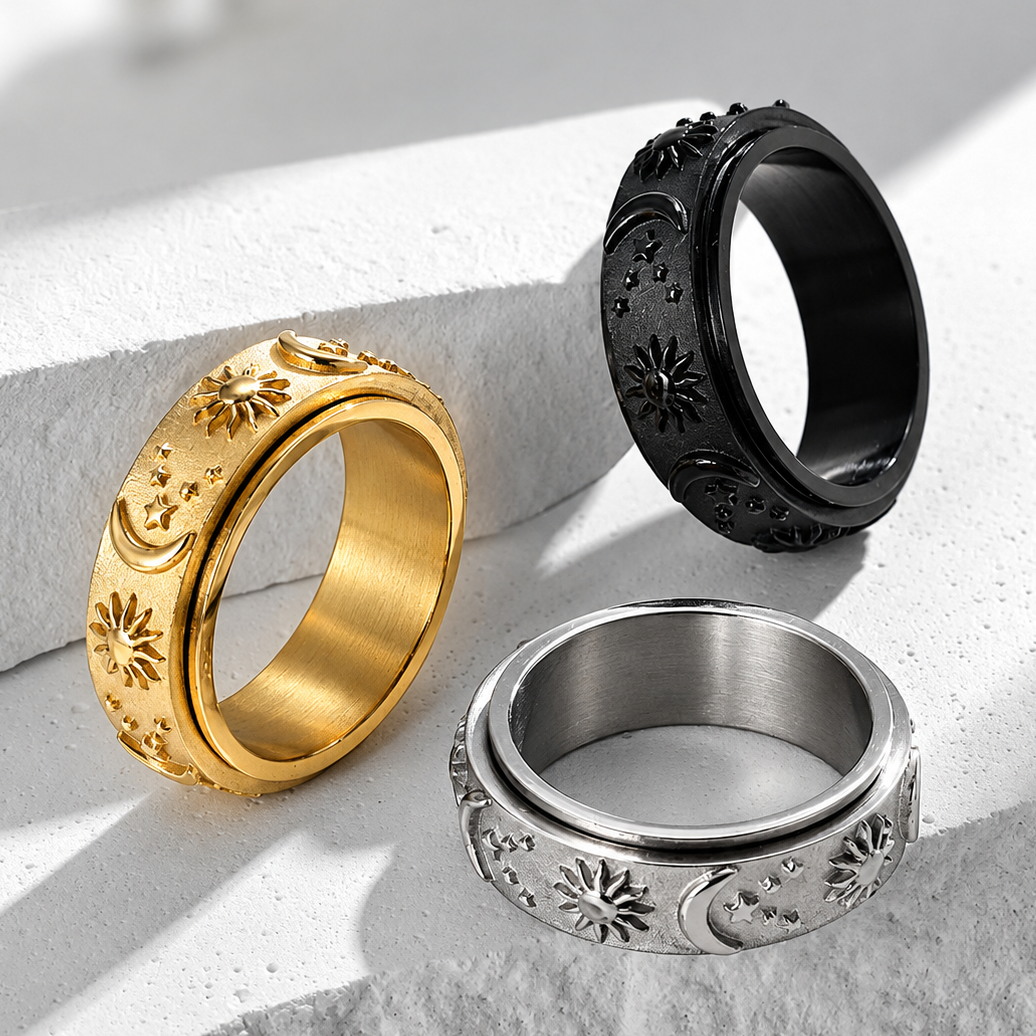 Bague anti-stress anneau tournant Circadien, anneau tournant sablé orné de soleils, lunes et étoiles en relief, dans tous ses coloris