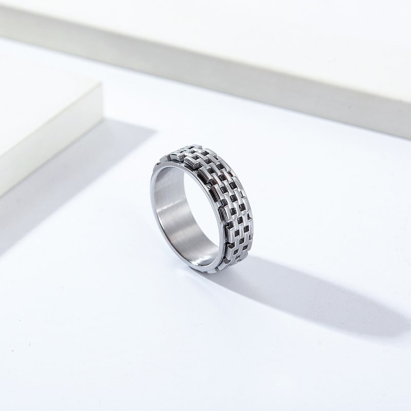 Bague anti-stress anneau tournant Muraille argentée, anneau tournant à motif de briques acier et noir