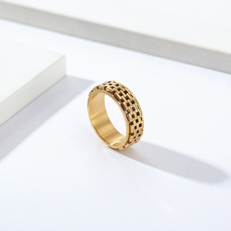 Bague anti-stress anneau tournant Muraille dorée, anneau tournant à motif de briques acier et noir