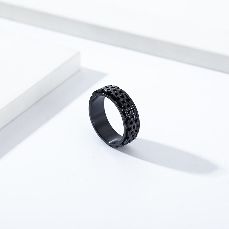 Bague anti-stress anneau tournant Muraille, anneau tournant à motif de briques acier et noir