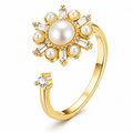 Bague anti-stress rotative Astre dorée, astre de perles blanches aux rayons de pierres taille baguette