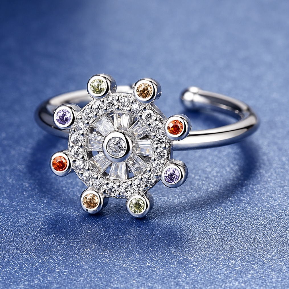 Bague anti-stress rotative Éther argentée, roue pavée ponctuée de pierres colorées, cœur de pierres baguette