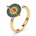 Bague anti-stress rotative Galaxie dorée, galaxie ceinte d’un anneau, sertie de pierres bleues, vertes, blanches et orangées