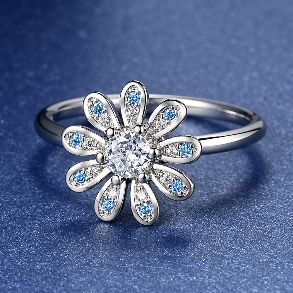 Bague anti-stress rotative Oxalis argentée, fleur aux pétales piqués de pierres bleues et roses