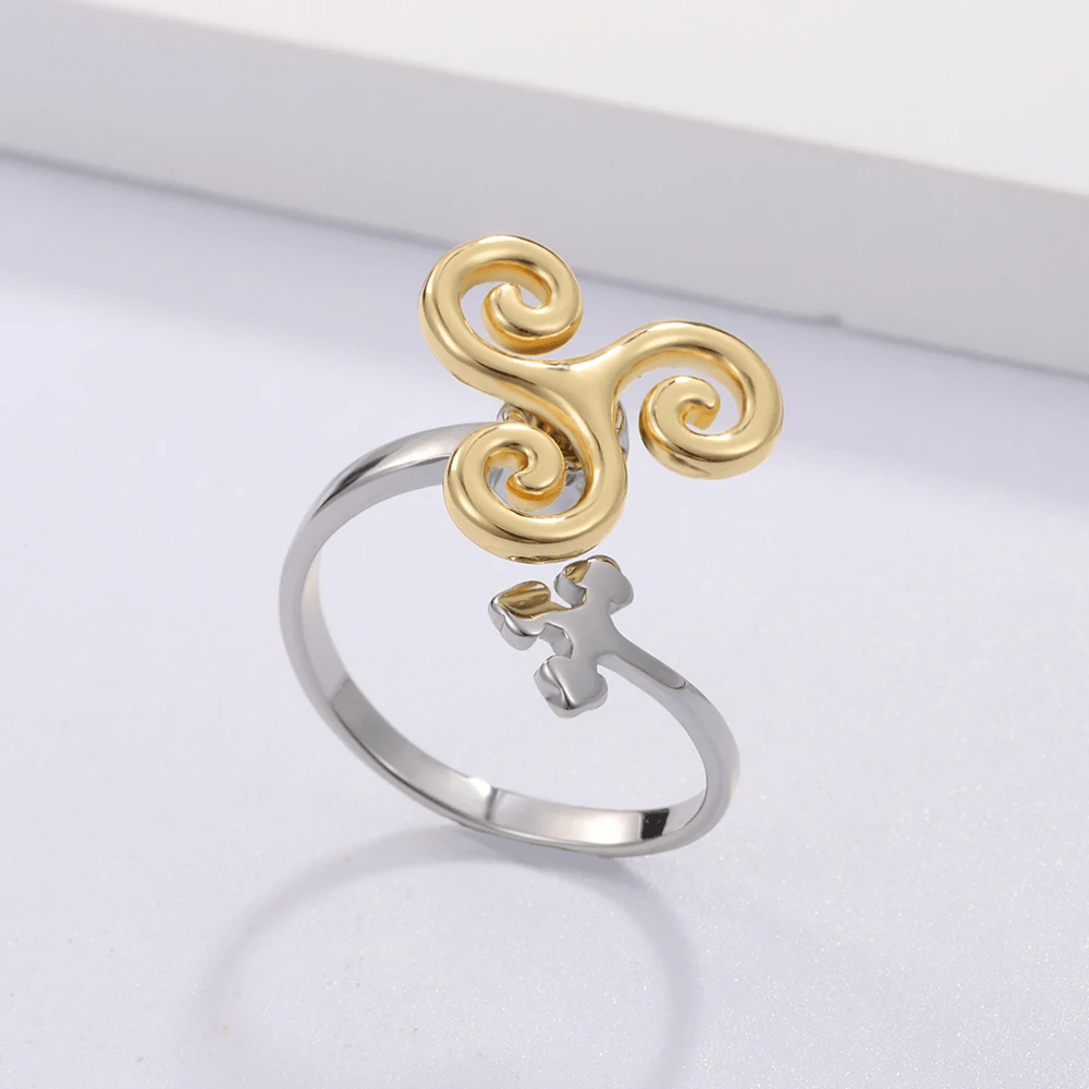 Bague anti-stress rotative Vague Déferlante, triskèle doré aux spirales en vagues, croix celte argentée