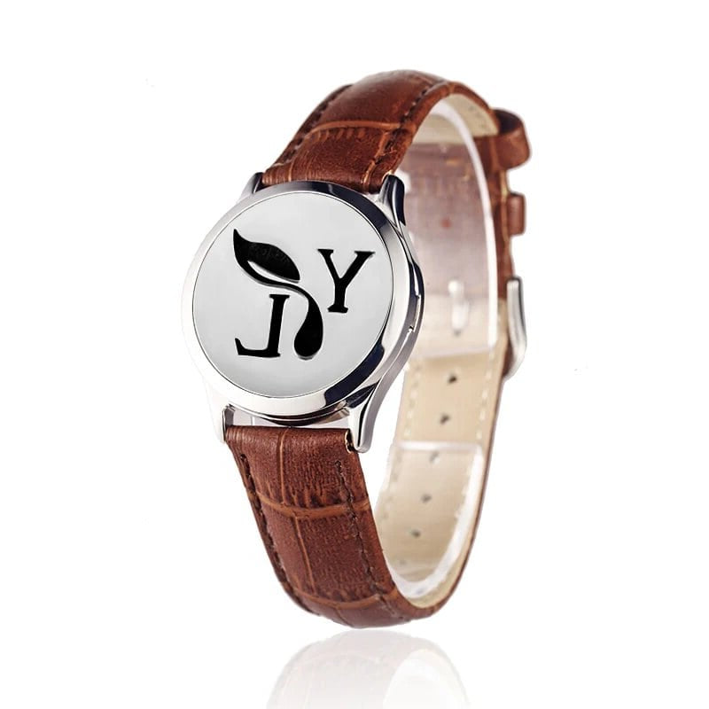 Bracelet diffuseur huile essentielle cuir marron YL argenté, médaillon monogramme YL et feuille sur bracelet en cuir marron