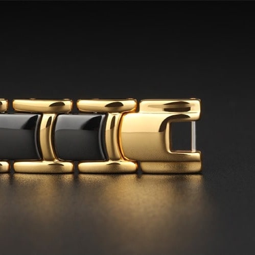 Bracelet magnétique Quilus, maillons dorés incrustés de plaques noires