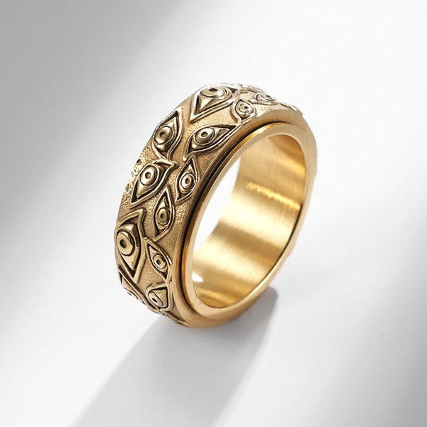 Bague anti-stress anneau tournant Argus dorée, anneau tournant ciselé d’yeux en relief, finition vieillie