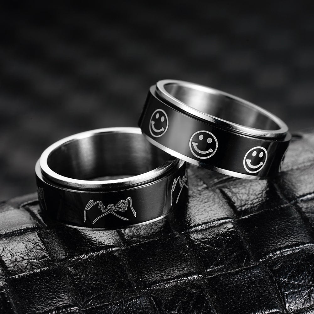 Bague anti-stress anneau tournant BlackSmile, anneau tournant noir orné de smileys argentés